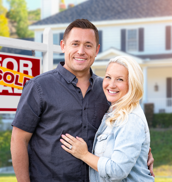 Couple in front of a home